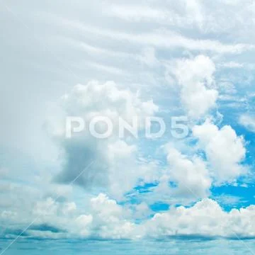 Blue sky and white cumulus clouds Stock Photos