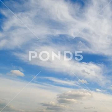 Blue sky and white cumulus clouds Stock Photos