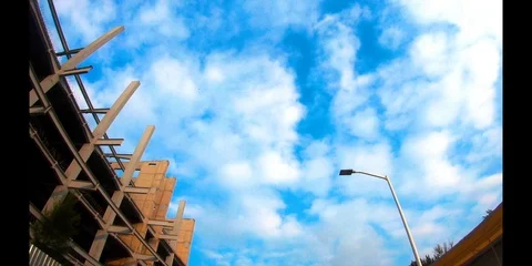 Blue sky with architecture and clouds. Stock Footage