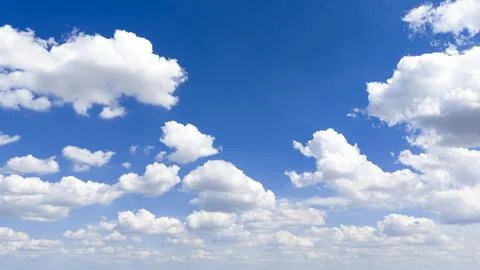 Blue sky background and clouds. Summer sky holds white clouds. Sunny sky ca.. 写真素材