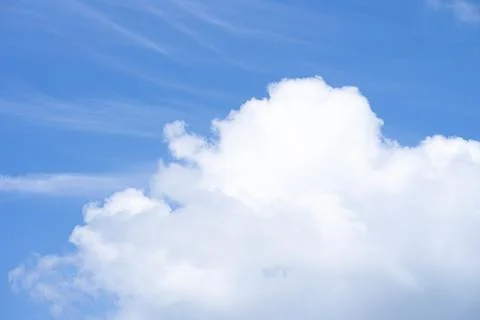 Blue sky background with big cloud. Stock Photos