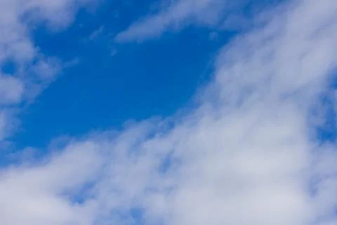 Blue sky background with cloud . Stock Photos