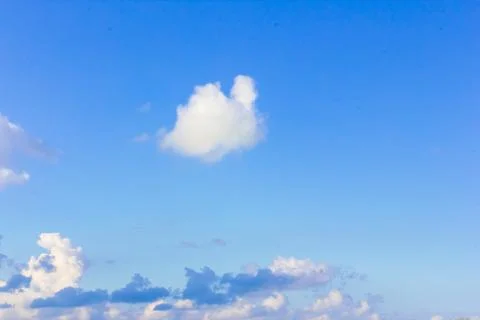 Blue sky background with clouds. Clouds on a clear day Foto stock