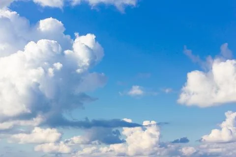 Blue sky background with clouds. Clouds on a clear day Stock Photos