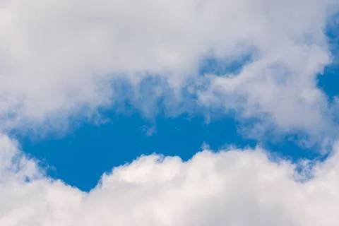 Blue sky background with clouds. Natural background Stock Photos