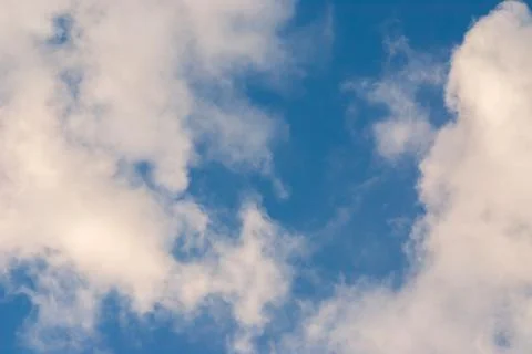 Blue sky background with clouds. Natural background Stock Photos