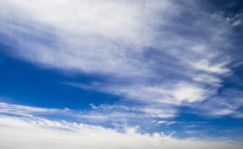 Blue sky background with clouds Фото
