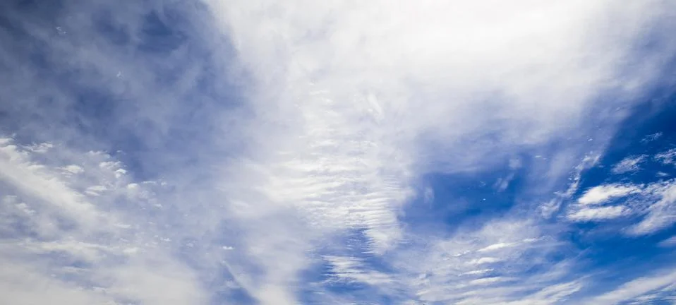 Blue sky background with clouds Фото