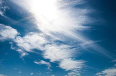 Blue sky background with clouds Фото