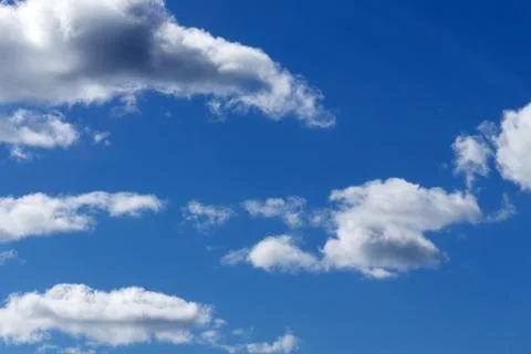 Blue sky background with clouds . Stock Photos