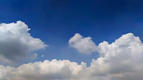 Blue sky background with clouds. Stock Photos