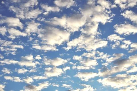 Blue sky background with clouds. Stock Photos