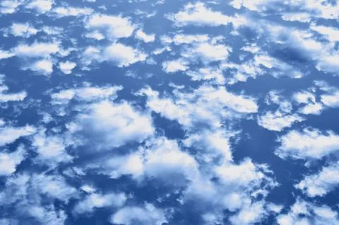 Blue sky background with clouds. Stock Photos