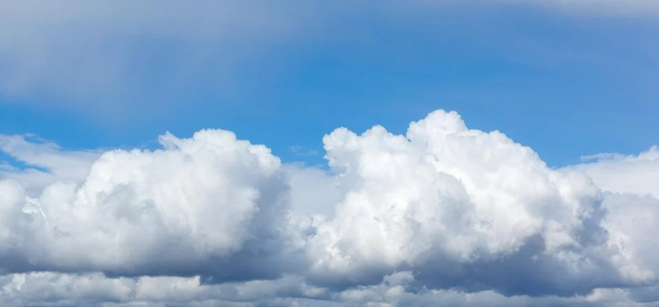 Blue sky background with clouds. Stock Photos
