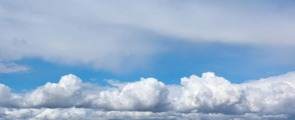 Blue sky background with clouds. Stock Photos