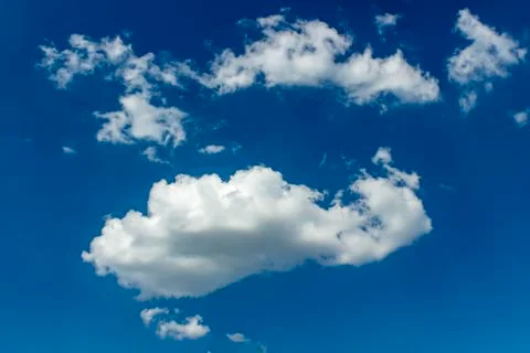 Blue sky background with clouds. Summer background. Stock Photos