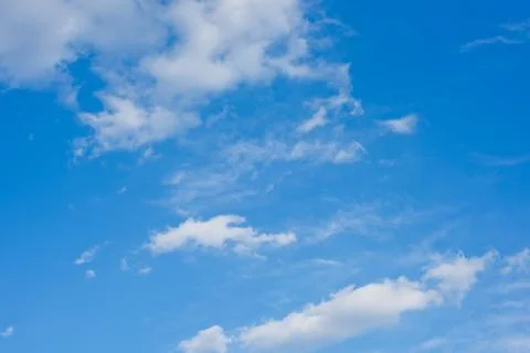 Blue sky background with clouds. Wallpaper. Stock Photos