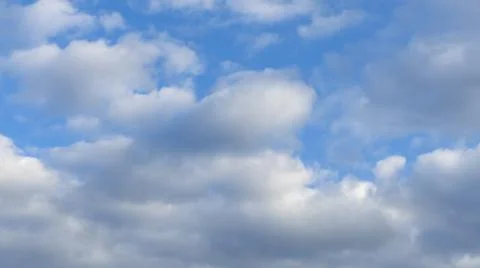 Blue sky background with clouds. White cumulus clouds in blue sky. Cloudy wea Stock Photos