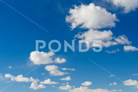 Blue sky background with Cumulus clouds Stock Photos