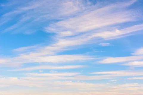 Blue sky background. Dynamic clouds. Stock Photos