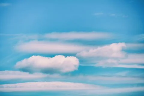 Blue sky background with floating white cloud Stock Photos