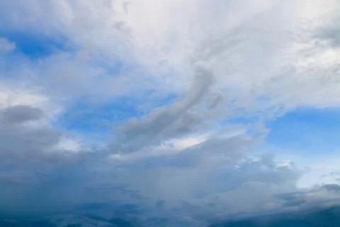 Blue sky background with many clouds Stock Photos