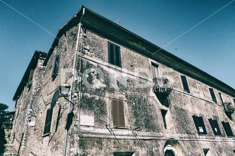 Blue sky on the background of a medieval edifice. Stock Photos