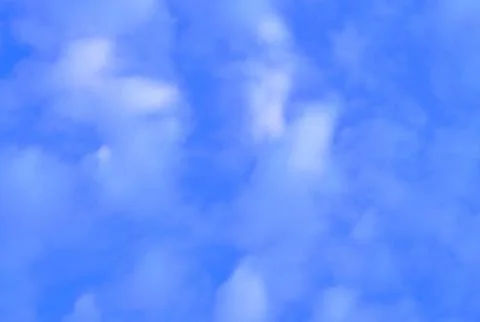 Blue Sky Background with Small White Clouds Stock Photos