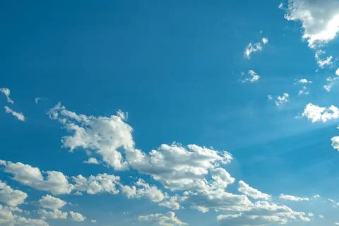 Blue sky background with small white clouds Stock Photos