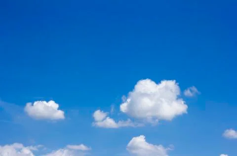 Blue sky background with tiny clouds Stock Photos