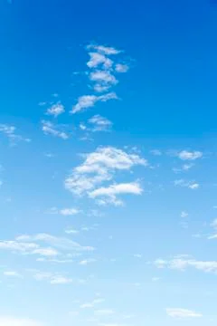 Blue sky background with tiny clouds Stock Photos
