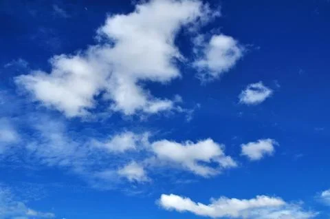 Blue sky background with tiny clouds Stock Photos
