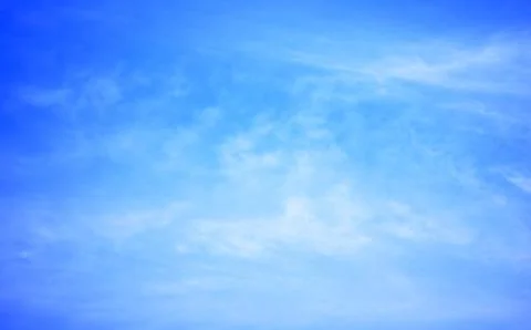 Blue sky background with tiny clouds Stock Photos