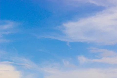 Blue sky background with tiny clouds Stock Photos
