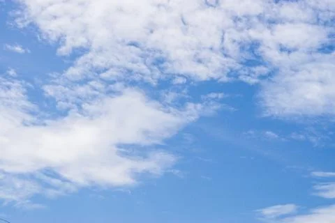 Blue sky background with tiny clouds Stock Photos