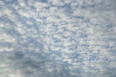 Blue sky background with tiny clouds Stock Photos