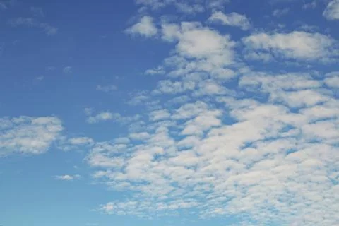 Blue sky background with tiny clouds Stock Photos