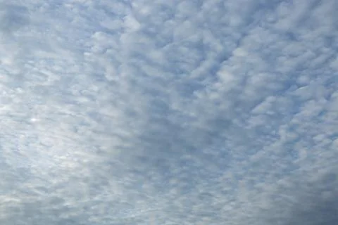 Blue sky background with tiny clouds Stock Photos