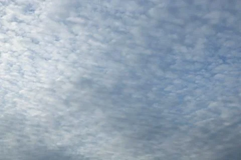 Blue sky background with tiny clouds Stock Photos