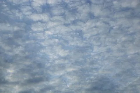 Blue sky background with tiny clouds Stock Photos
