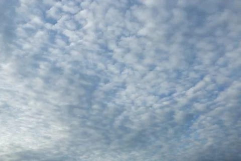 Blue sky background with tiny clouds Stock Photos