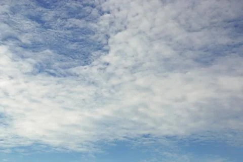 Blue sky background with tiny clouds Stock Photos
