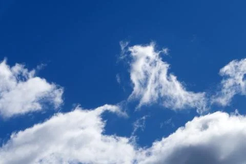 Blue sky background with tiny clouds . Stock Photos
