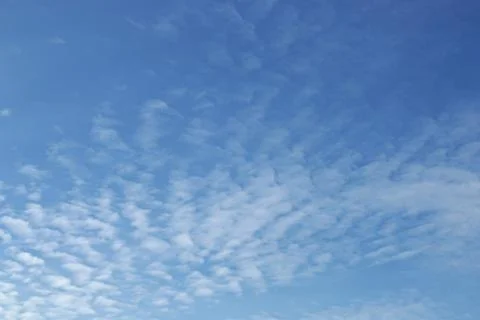 Blue sky background with tiny clouds Stock Photos