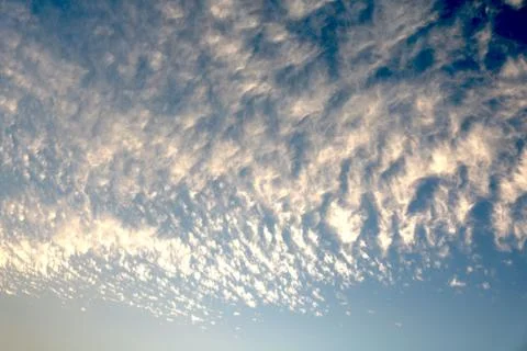 Blue sky background with tiny clouds Stock Photos