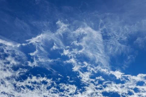Blue sky background with tiny clouds Stock Photos