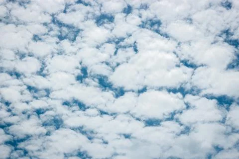 Blue sky background with tiny clouds Stock-Fotos