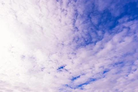 Blue sky background with tiny clouds Stock Photos