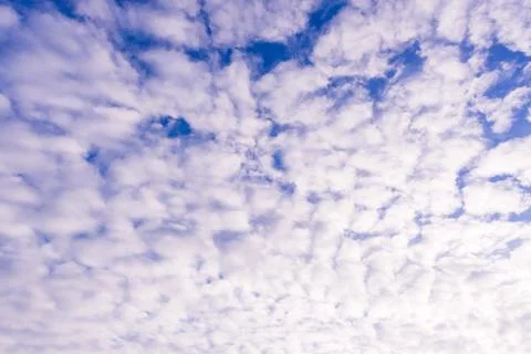 Blue sky background with tiny clouds Stock Photos