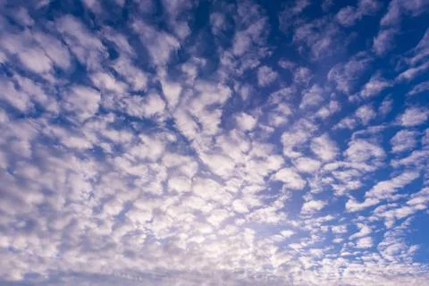 Blue sky background with tiny clouds Stock Photos